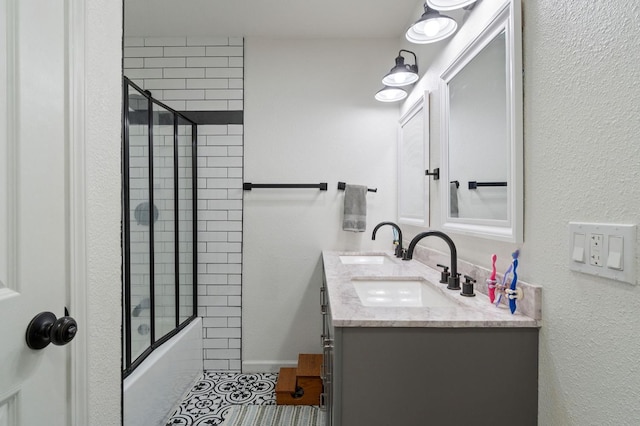 43299 Ranger Circle Dr, Coarsegold, CA 93614 - bathroom with double vanity, a sink, tile patterned floors, and bath / shower combo with glass door