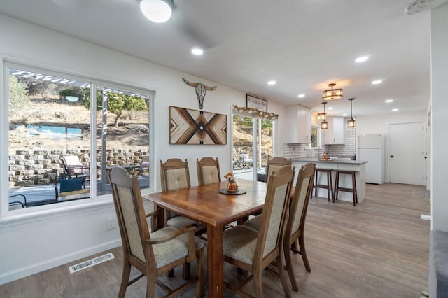 43299 Ranger Circle Dr, Coarsegold, CA 93614 - dining room featuring visible vents, recessed lighting, light wood-style flooring, and baseboards