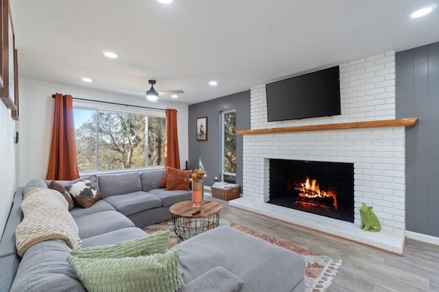 43299 Ranger Circle Dr, Coarsegold, CA 93614 - living area with a brick fireplace, recessed lighting, and wood finished floors