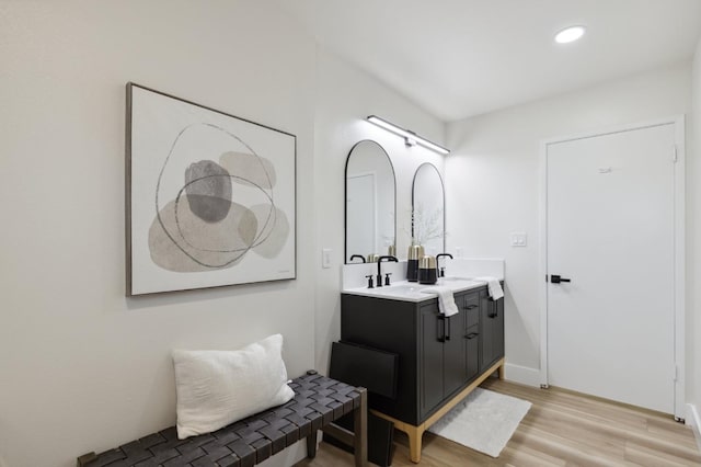 2044 W San Bruno Ave, Fresno, CA 93711 - bathroom with double vanity, recessed lighting, and wood finished floors