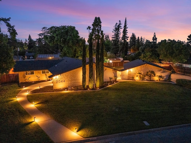 2044 W San Bruno Ave, Fresno, CA 93711 - view of front of home with a lawn and fence
