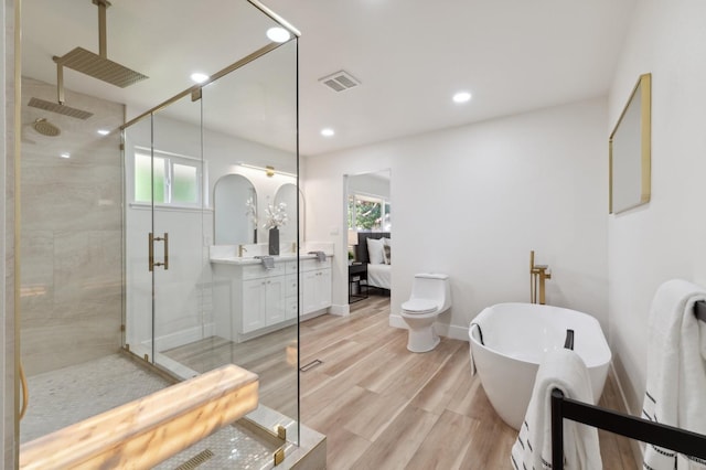 2044 W San Bruno Ave, Fresno, CA 93711 - full bathroom with visible vents, plenty of natural light, a stall shower, and wood finished floors