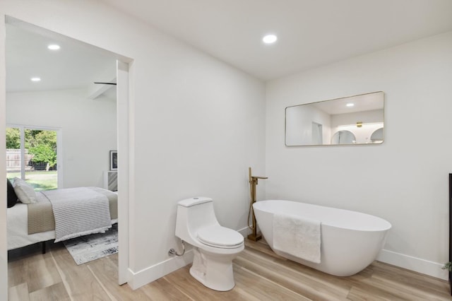 2044 W San Bruno Ave, Fresno, CA 93711 - ensuite bathroom with wood finished floors, baseboards, connected bathroom, a soaking tub, and recessed lighting