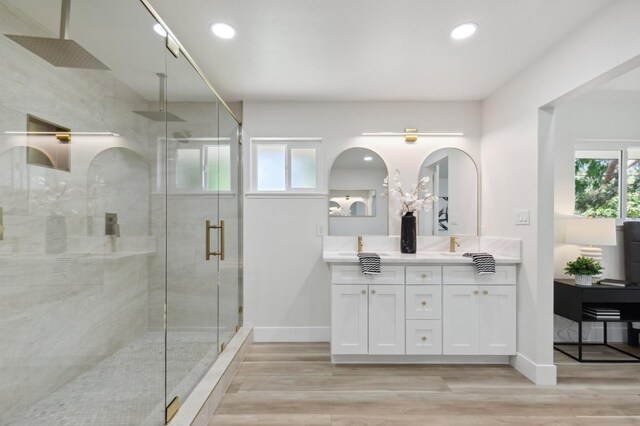 2044 W San Bruno Ave, Fresno, CA 93711 - full bath with a shower stall, wood finished floors, vanity, baseboards, and recessed lighting