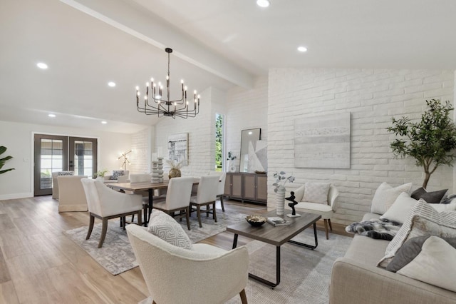 2044 W San Bruno Ave, Fresno, CA 93711 - living room featuring brick wall, a notable chandelier, vaulted ceiling with beams, and light wood-type flooring