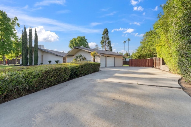2044 W San Bruno Ave, Fresno, CA 93711 - single story home with an attached garage, fence, and concrete driveway