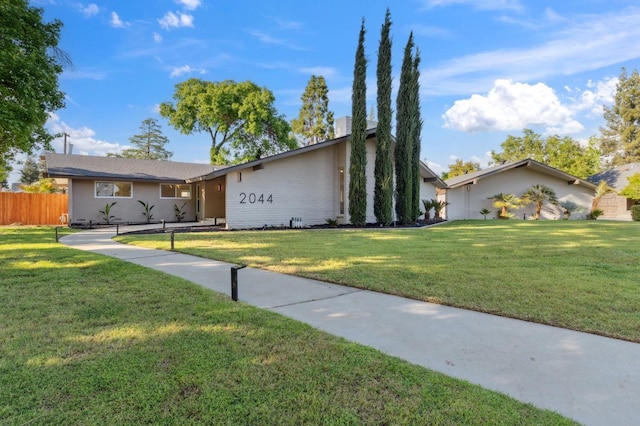 2044 W San Bruno Ave, Fresno, CA 93711 - view of front of house with a front lawn and fence