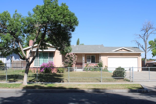 1939 S Sierra Vista Ave, Fresno, CA 93702 - ranch-style house with driveway, stucco siding, a fenced front yard, and a garage