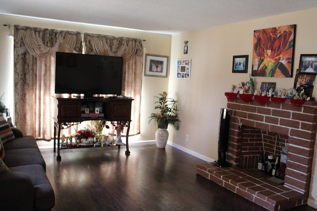 1939 S Sierra Vista Ave, Fresno, CA 93702 - living area featuring wood finished floors, baseboards, and a fireplace