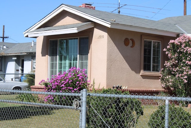1939 S Sierra Vista Ave, Fresno, CA 93702 - view of home's exterior with fence and stucco siding