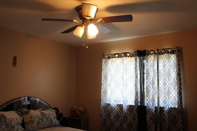1939 S Sierra Vista Ave, Fresno, CA 93702 - bedroom with ceiling fan and a textured ceiling