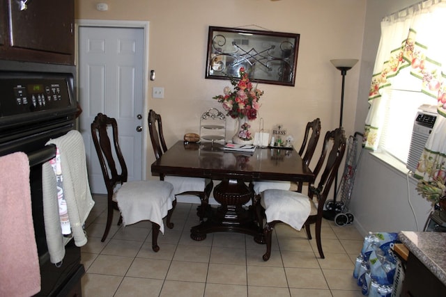 1939 S Sierra Vista Ave, Fresno, CA 93702 - dining area with baseboards, cooling unit, and light tile patterned floors