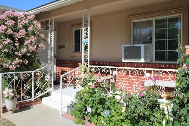 1939 S Sierra Vista Ave, Fresno, CA 93702 - property entrance featuring covered porch, cooling unit, and brick siding