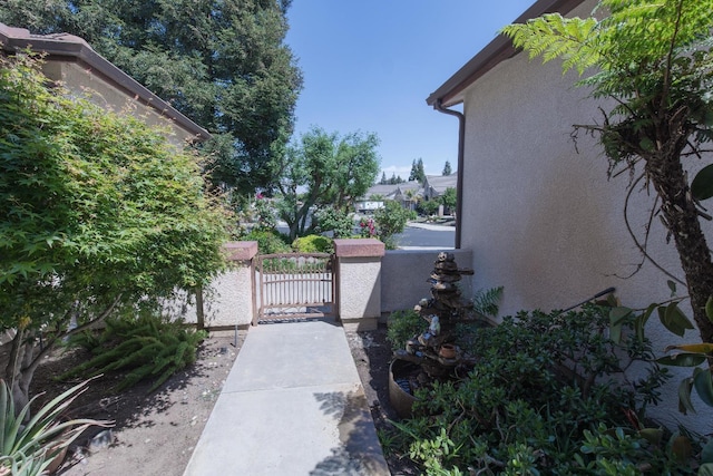 view of gate featuring fence