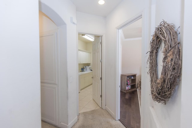 corridor with light carpet and recessed lighting