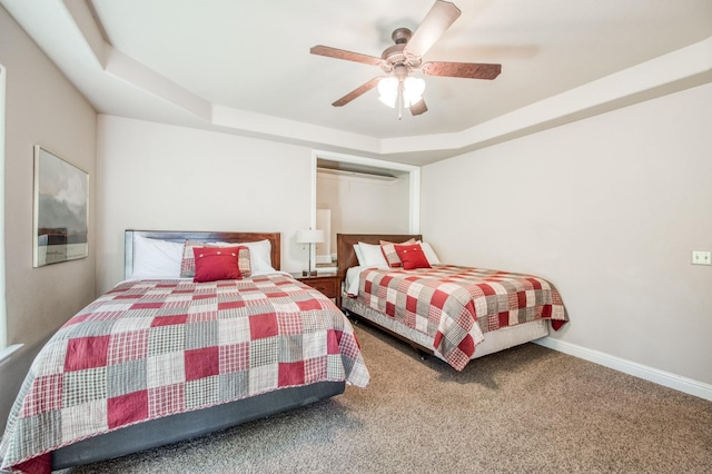 bedroom with carpet floors, a ceiling fan, and baseboards