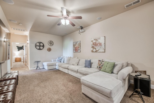 living room with a ceiling fan, baseboards, visible vents, and carpet
