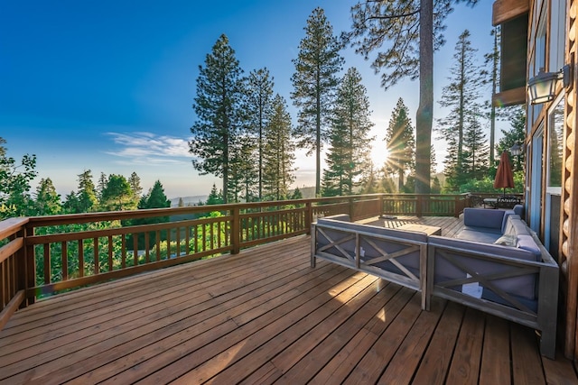 wooden terrace featuring an outdoor hangout area
