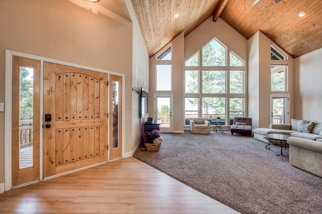 entrance foyer with beam ceiling, high vaulted ceiling, wood ceiling, and wood finished floors