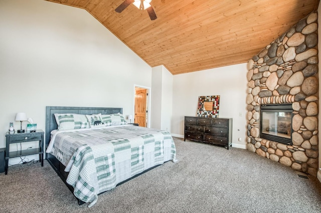 bedroom with baseboards, wood ceiling, high vaulted ceiling, a fireplace, and carpet floors