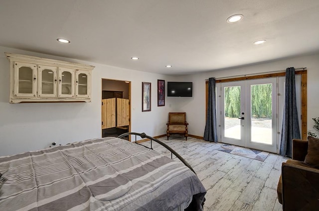 bedroom featuring light wood finished floors, french doors, access to exterior, baseboards, and recessed lighting