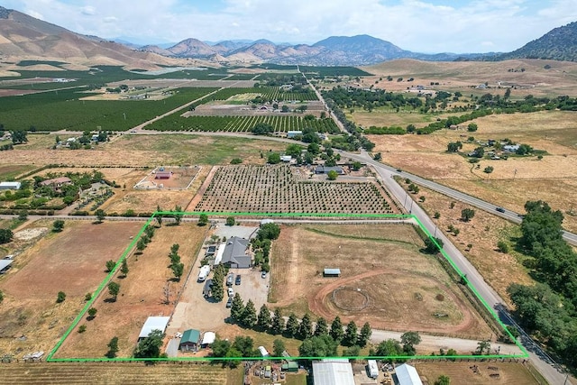 aerial view featuring a mountain view and a rural view