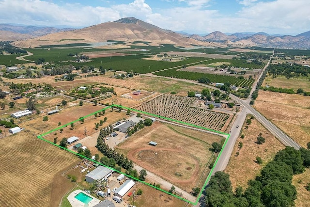 20794 E Weldon Ave, Sanger, CA 93657 - aerial view of sparsely populated area featuring abundant farmland, property boundaries highlighted, and a mountain backdrop