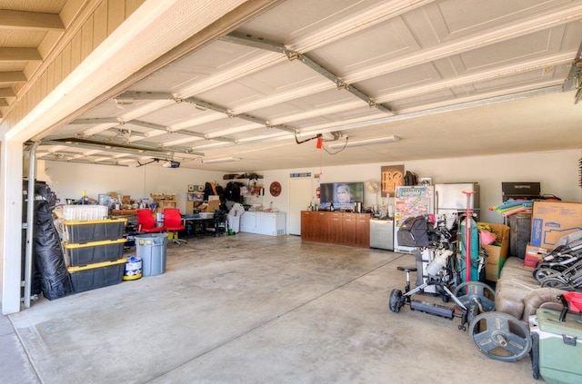 garage featuring a workshop area and a garage door opener