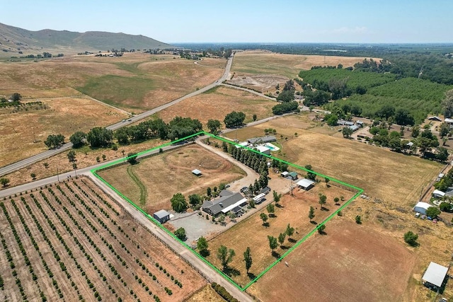 aerial view featuring a rural view and a mountain view