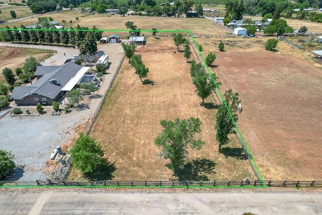 birds eye view of property featuring a rural view
