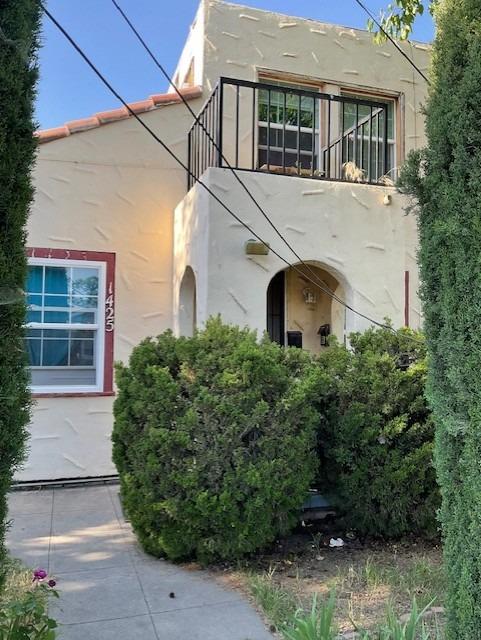 view of home's exterior featuring stucco siding and a balcony
