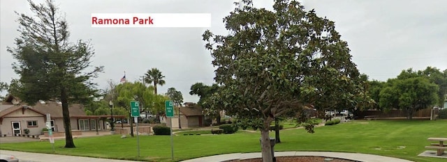 view of community featuring a lawn