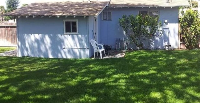 view of outbuilding with an outbuilding and fence