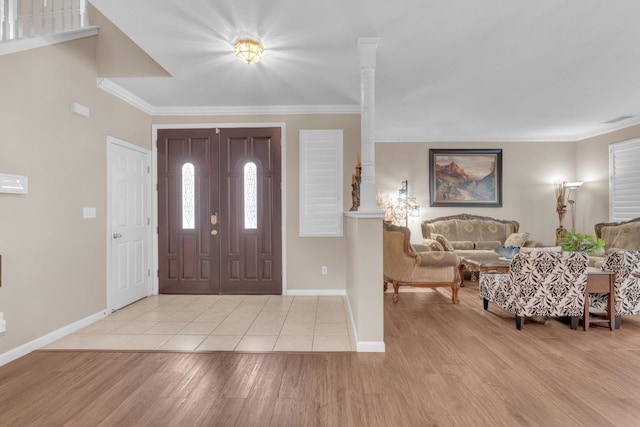 2776 Keats Ave, Clovis, CA 93611 - foyer with light wood finished floors, visible vents, baseboards, and ornamental molding