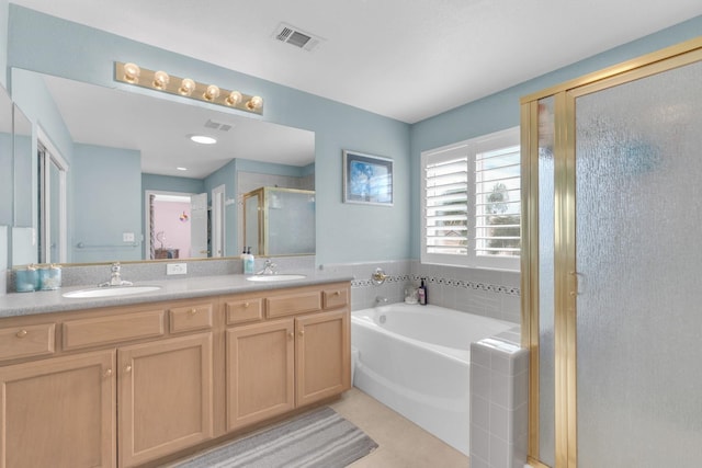 2776 Keats Ave, Clovis, CA 93611 - bathroom featuring double vanity, a garden tub, a stall shower, a sink, and visible vents
