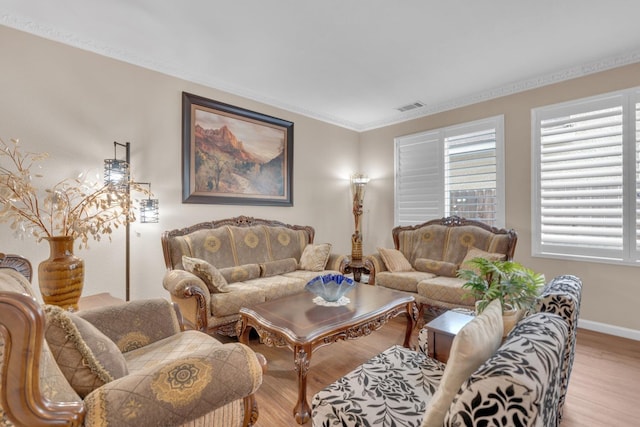 2776 Keats Ave, Clovis, CA 93611 - living area with baseboards, crown molding, visible vents, and wood finished floors
