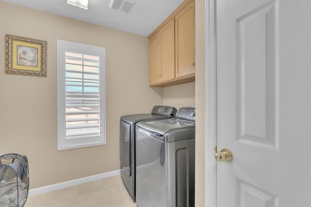 2776 Keats Ave, Clovis, CA 93611 - washroom with baseboards, light tile patterned floors, washer and dryer, visible vents, and cabinet space