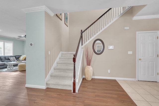 2776 Keats Ave, Clovis, CA 93611 - staircase with crown molding, wood finished floors, baseboards, and ceiling fan