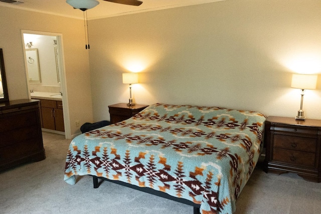 bedroom with ornamental molding, light carpet, connected bathroom, and visible vents