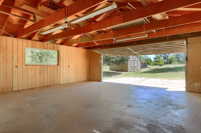 garage featuring a shed