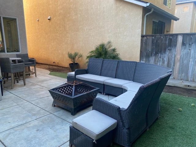 view of patio / terrace featuring an outdoor hangout area and fence