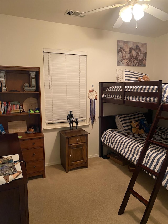 bedroom with light carpet, baseboards, visible vents, and ceiling fan