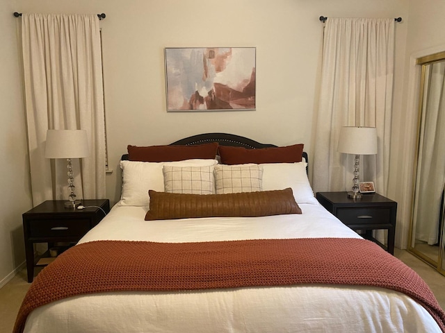 bedroom featuring baseboards and carpet floors