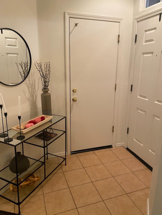 entryway featuring light tile patterned flooring