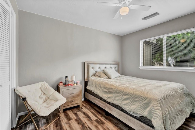 bedroom featuring a ceiling fan and wood finished floors