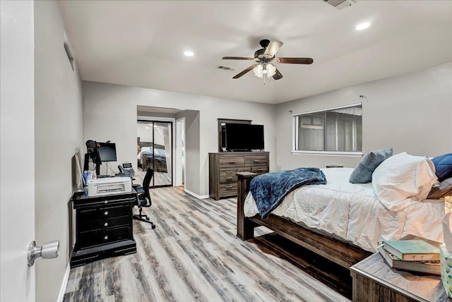 bedroom featuring baseboards, visible vents, recessed lighting, and wood finished floors