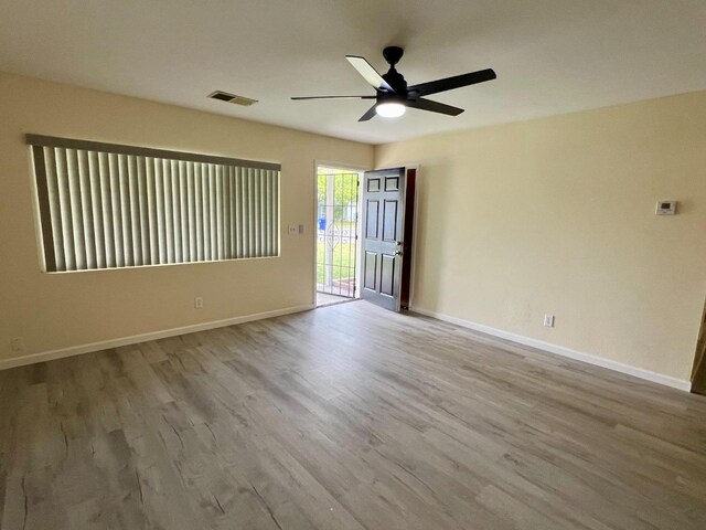 3330 Virginia St, Atwater, CA 95301 - empty room with baseboards, a ceiling fan, visible vents, and wood finished floors