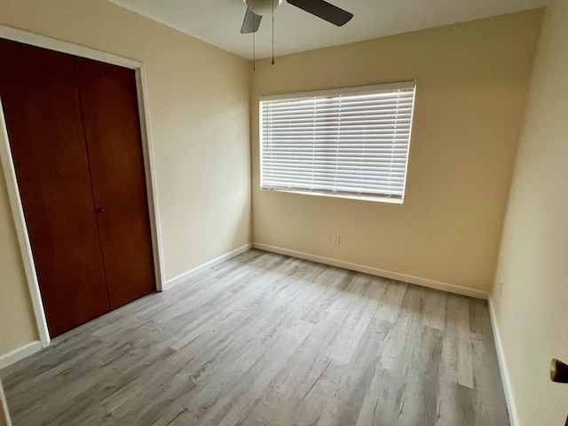 3330 Virginia St, Atwater, CA 95301 - unfurnished bedroom with ceiling fan, baseboards, a closet, and wood finished floors