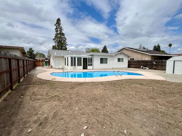 3330 Virginia St, Atwater, CA 95301 - view of pool featuring a patio, a fenced in pool, a shed, and a fenced backyard