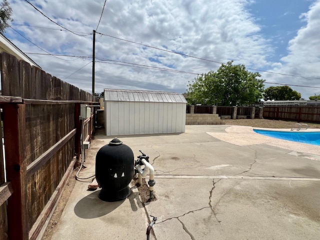 3330 Virginia St, Atwater, CA 95301 - view of patio with an outbuilding, a fenced in pool, a fenced backyard, and a storage unit